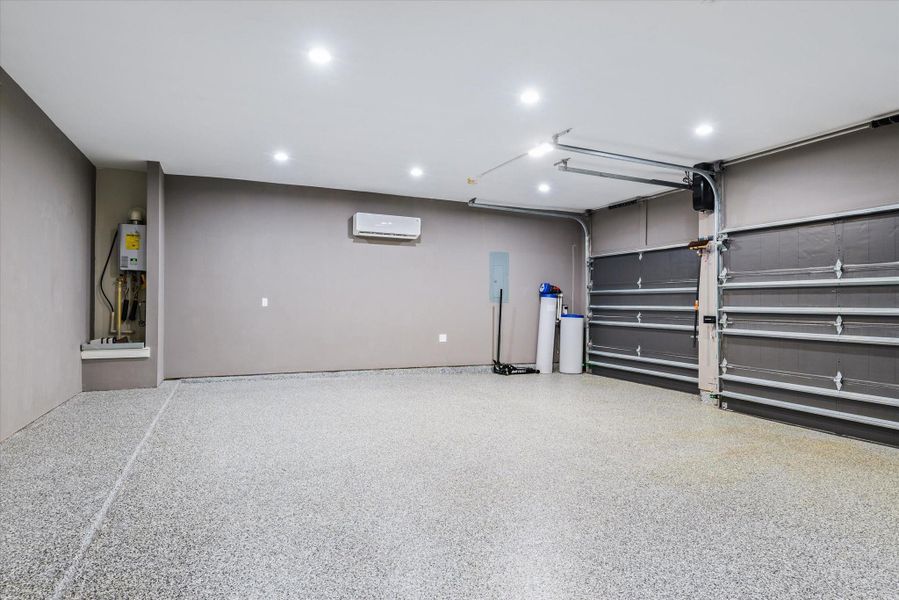 Garage with AC and epoxy floor with low profile garage door opener