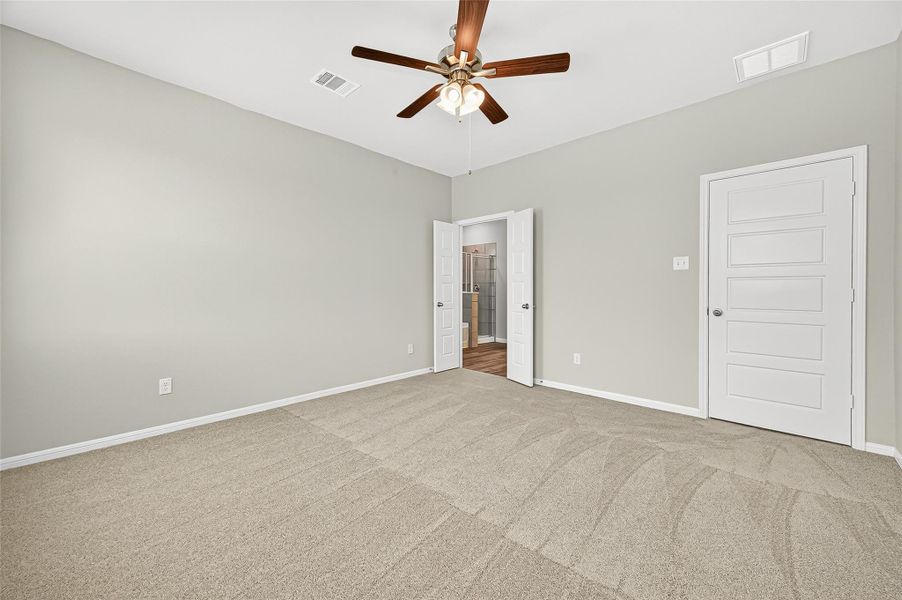 Spacious, unfurnished interior of a new home in Sunterra, Katy (Image 22).