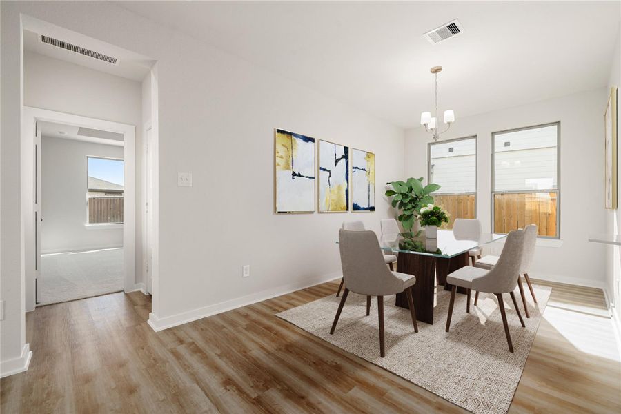This bright dining area is filled with natural light from large windows and features clean lines and neutral tones. Its open layout creates a comfortable, airy atmosphere ideal for everyday living. This bright dining area is filled with natural light from large windows and features clean lines and neutral tones. Its open layout creates a comfortable, airy atmosphere ideal for everyday living.