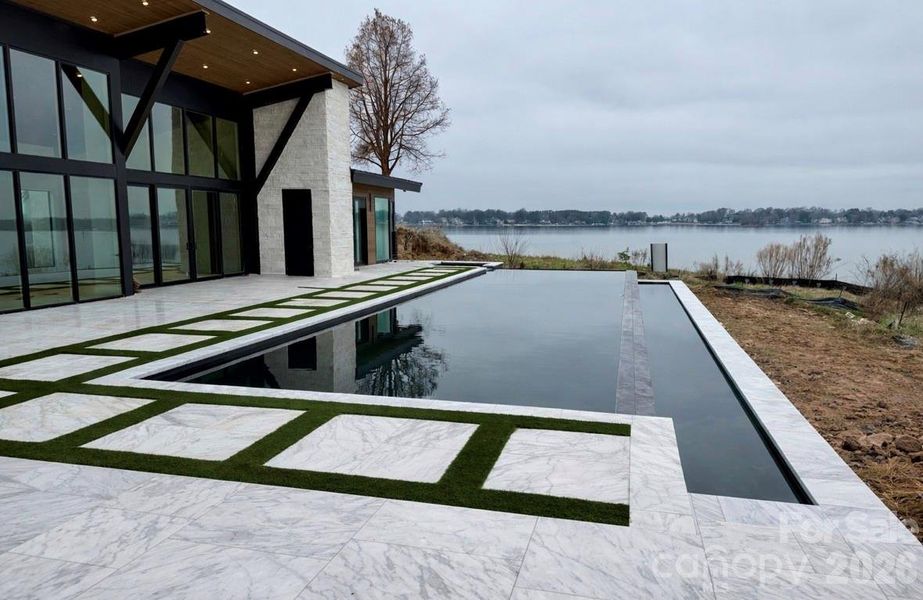 60’ Double Infinity Edge Saltwater Lap Pool w/ Cabo Shelf & Integrated Hot Tub - View From Living Room/Entertainment Area