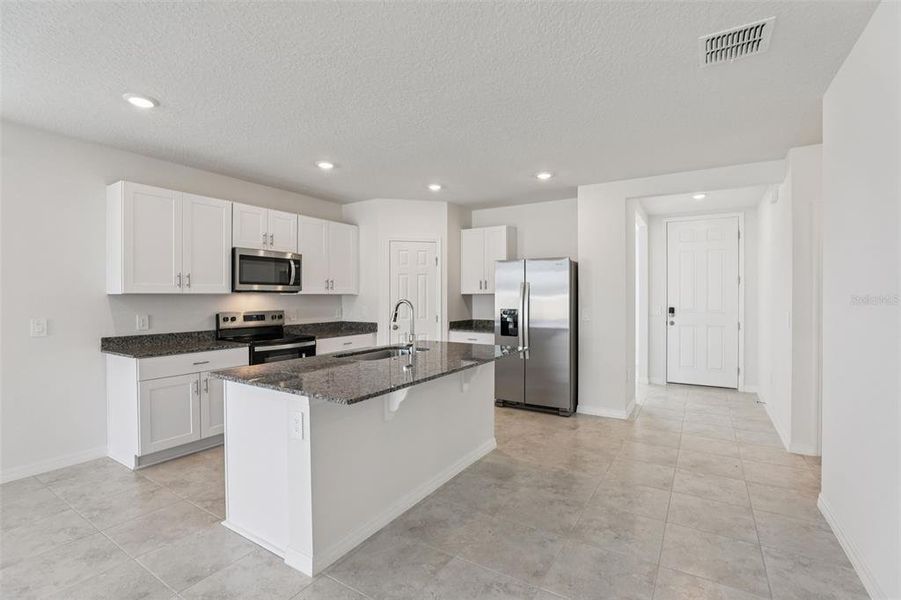 Furnished interior view inside a new home in Lawson Dunes - Signature Series, Haines City (Image 5).