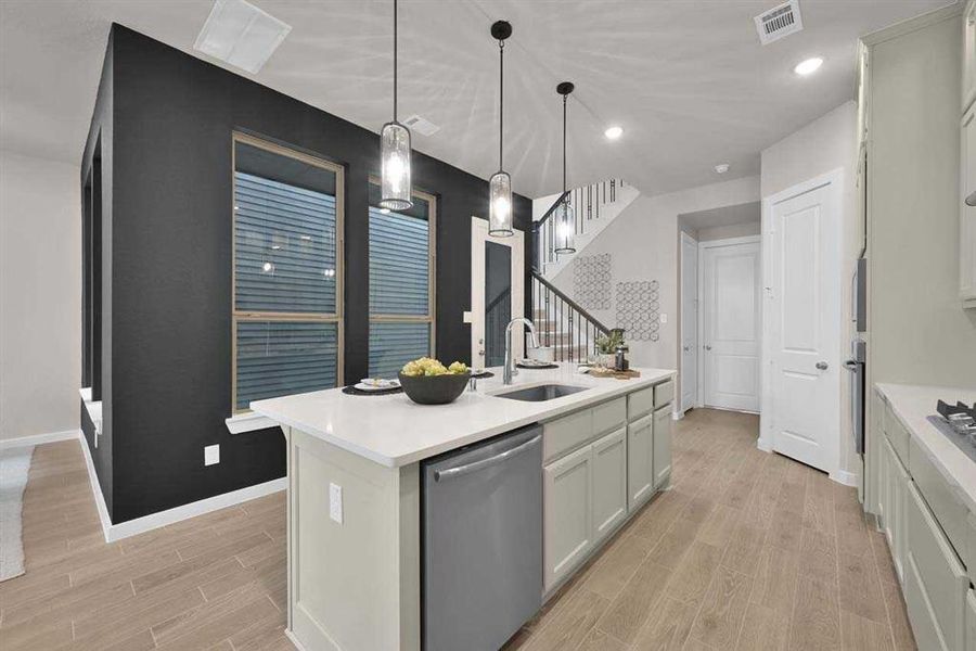 GFunctional flow between kitchen, dining, and main living area. (Original Builder Staged Photo 2024)