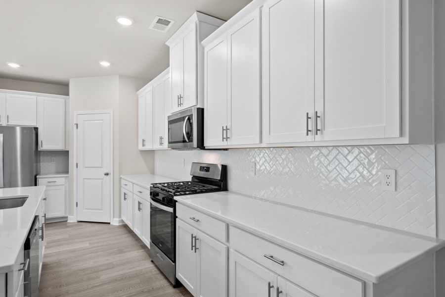 Furnished interior view inside a new home in Cypress Ridge - The Coastline Series, Longs (Image 7).