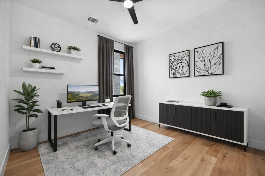 Office area featuring a ceiling fan and light wood-style flooring