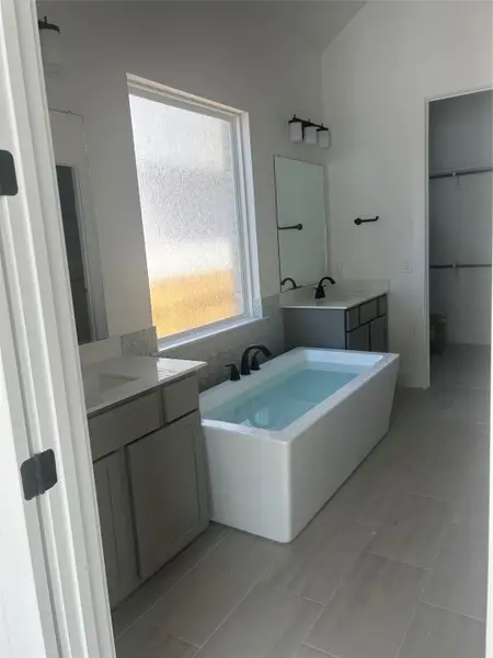 Primary Bath retreat with dual vanities & soaking tub Primary Bath retreat with dual vanities & soaking tub