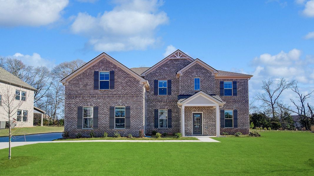Representative exterior photo of a completed home built from the Meridian II by DRB Homes in Cambria at Traditions, Hampton, GA (Image 20). Representative exterior photo of a completed home built from the Meridian II by DRB Homes in Cambria at Traditions, Hampton, GA (Image 20).