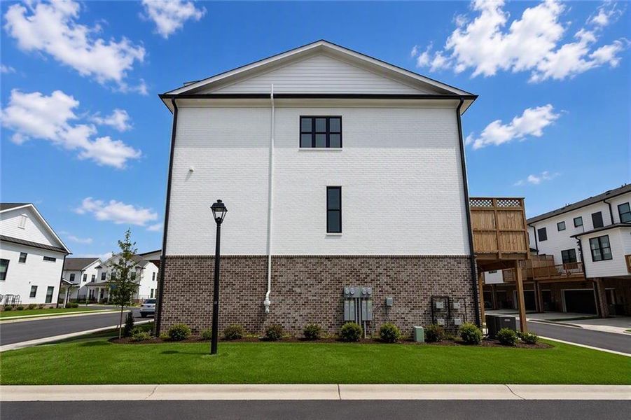 Front exterior of a new home in Millcroft, Buford, GA, highlighting curb appeal (Image 24).
