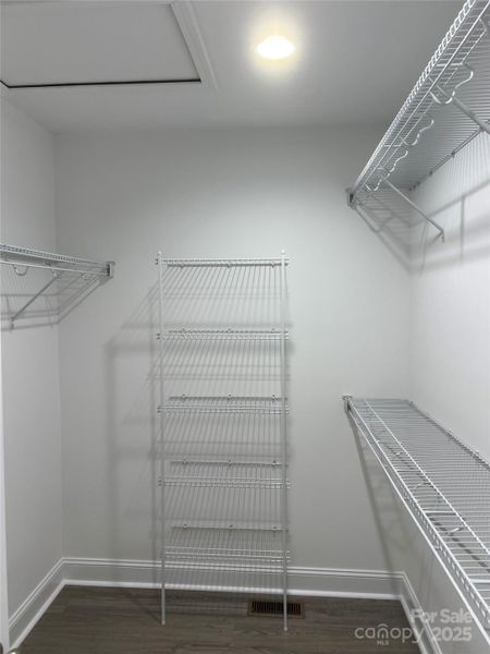 Primary Bedroom Walk-in Closet Primary Bedroom Walk-in Closet