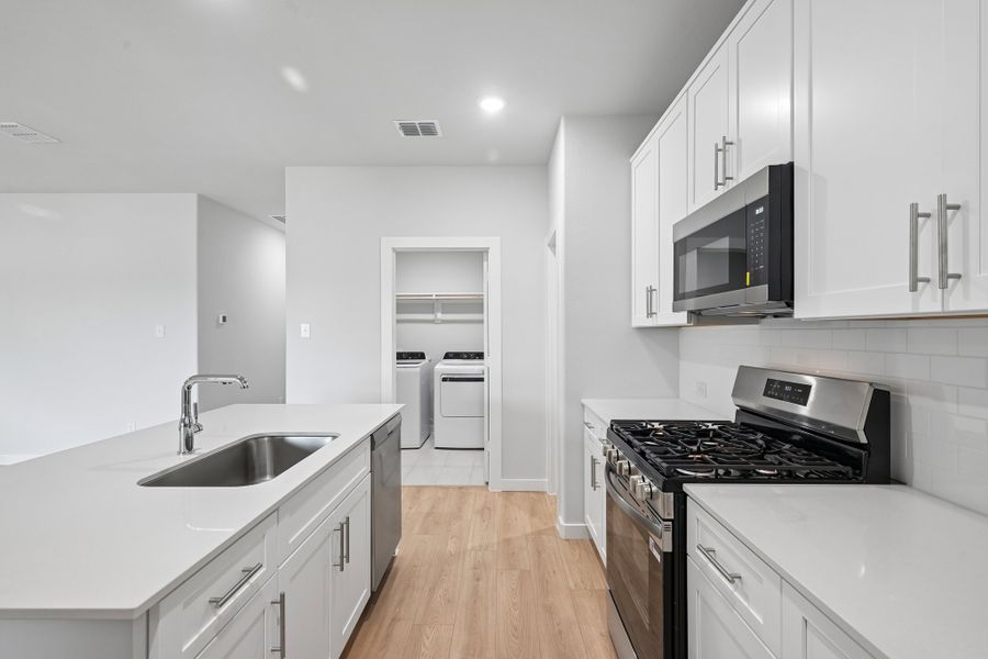 Kitchen in the Hayden home plan by Trophy Signature Homes