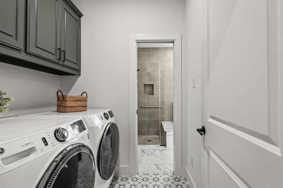 Laundry room featuring independent washer and dryer and cabinet space Laundry room featuring independent washer and dryer and cabinet space