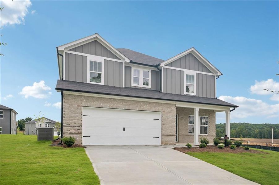 Front exterior of a new home in Northwoods at Mirror Lake, Villa Rica, GA, highlighting curb appeal (Image 26).