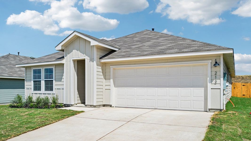 Front exterior of a new home in Prairie Lakes, Buda, TX, highlighting curb appeal (Image 2).