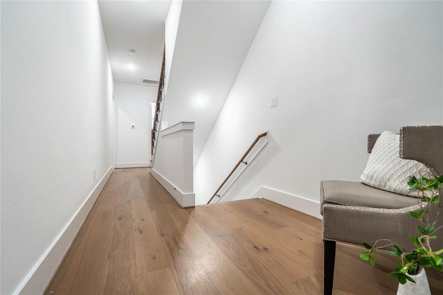 Hallway and stairs heading to the second and third bedroom.