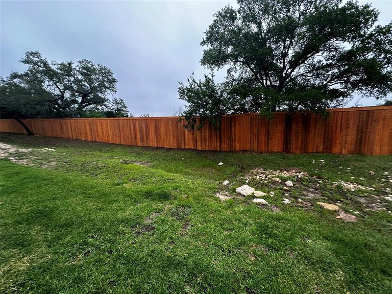 Buyer can opt to add a wrought iron fence to enclose their yard area.