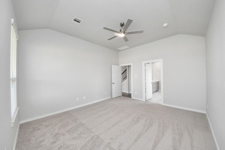 Escape and relax in the exquisite primary suite, a haven to unwind after a long day. The spacious room, located on first floor, boasts plush carpeting, soothing paint tones, high ceilings, and expansive windows adorned with privacy blinds. Escape and relax in the exquisite primary suite, a haven to unwind after a long day. The spacious room, located on first floor, boasts plush carpeting, soothing paint tones, high ceilings, and expansive windows adorned with privacy blinds.