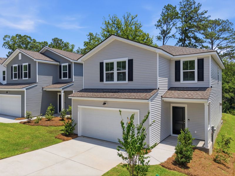 Front exterior of a new home in Grand Arbor, Blythewood, SC, highlighting curb appeal (Image 1). Front exterior of a new home in Grand Arbor, Blythewood, SC, highlighting curb appeal (Image 1).