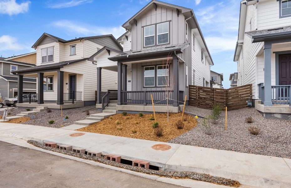 Front exterior of a new home in Barefoot Village, Firestone, CO, highlighting curb appeal (Image 25). Front exterior of a new home in Barefoot Village, Firestone, CO, highlighting curb appeal (Image 25).