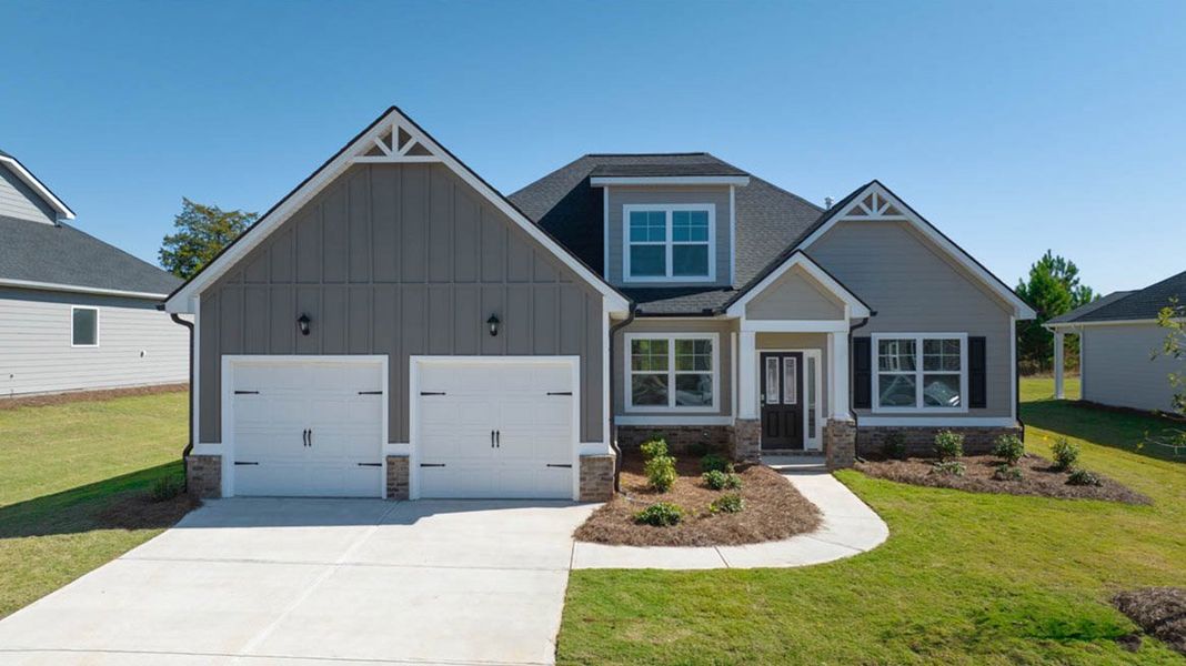 Front exterior of a new home in The Gates at Pates Creek, Hampton, GA, highlighting curb appeal (Image 1).
