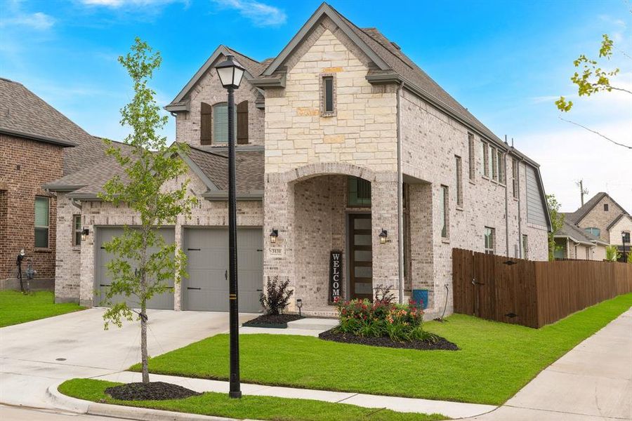 Front exterior of a new home in Avondale, Fate, TX, highlighting curb appeal (Image 26). Front exterior of a new home in Avondale, Fate, TX, highlighting curb appeal (Image 26).