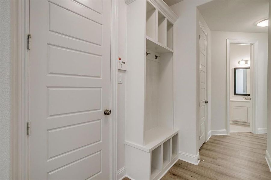 Mudroom featuring light wood-type flooring