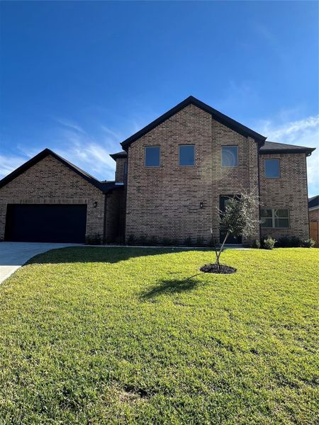 Front exterior of a new home in , Spring, TX, highlighting curb appeal (Image 1). Front exterior of a new home in , Spring, TX, highlighting curb appeal (Image 1).