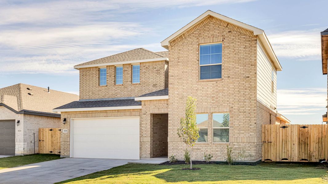 Front exterior of a new home in Northwest Passage, Midland, TX, highlighting curb appeal (Image 2). Front exterior of a new home in Northwest Passage, Midland, TX, highlighting curb appeal (Image 2).
