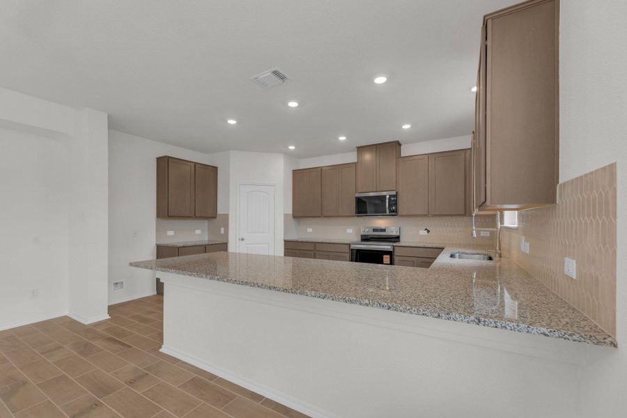 Furnished interior view inside a new home in Mustang Valley, Manor (Image 11).