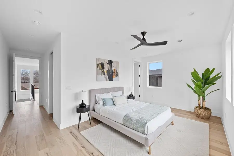 Bedroom with light wood-style flooring and ceiling fan