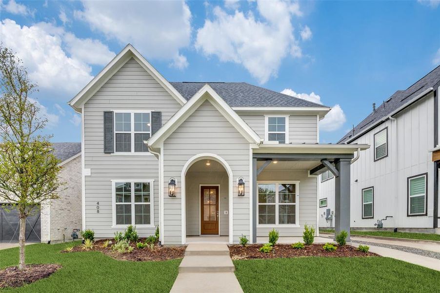 View of front of house with a front yard