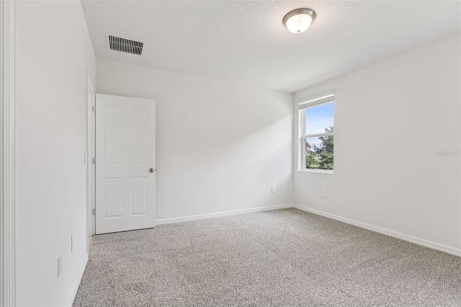 Spacious, unfurnished interior of a new home in Bradbury Creek - Signature Series, Haines City (Image 32).