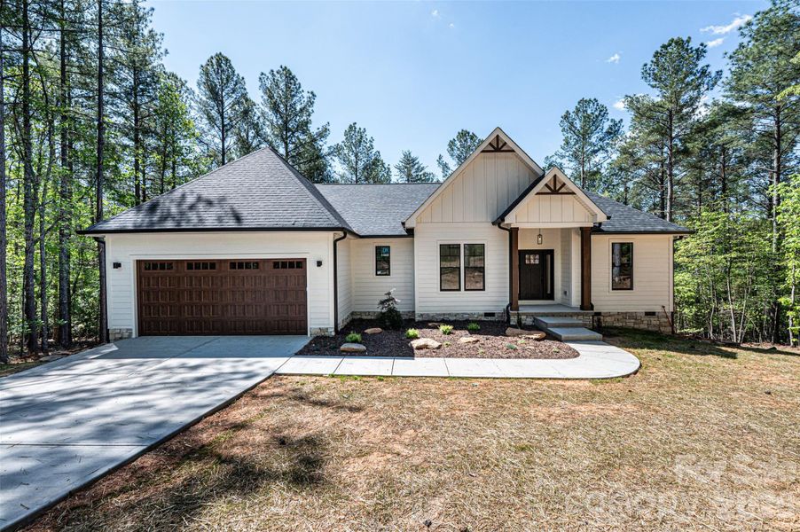Front exterior of a new home in , Connelly Springs, NC, highlighting curb appeal (Image 2). Front exterior of a new home in , Connelly Springs, NC, highlighting curb appeal (Image 2).