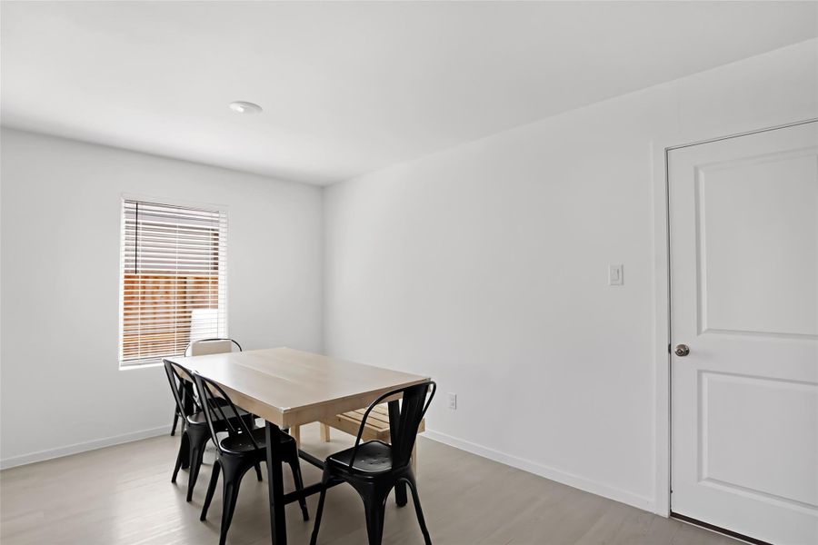Spacious dining area with side window view.
