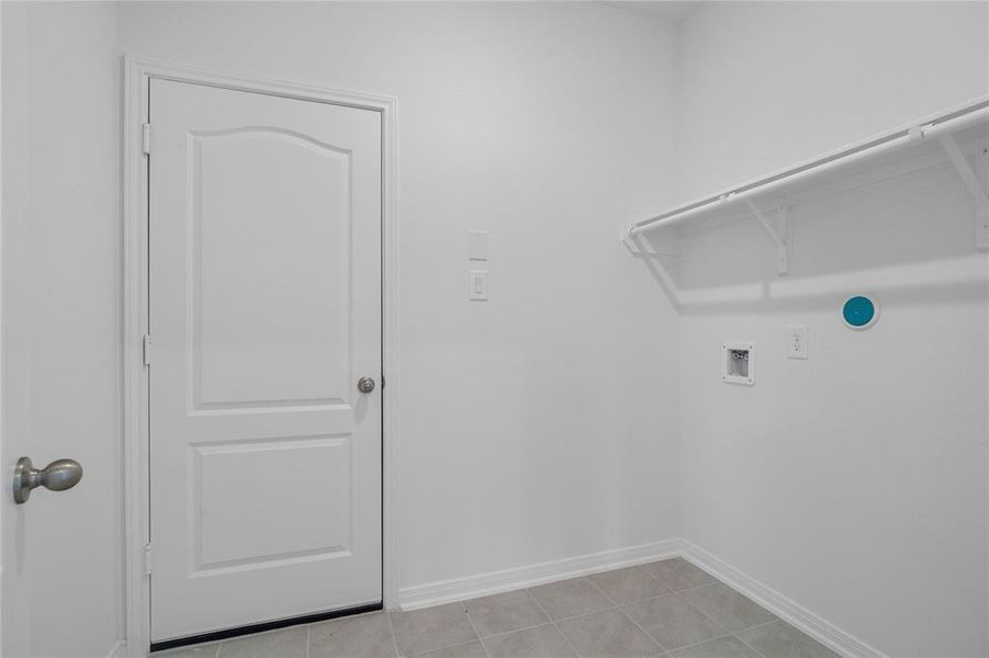 The Utility Room is spacious for your washer & dryer appliances and has a high shelf for all your laundering supplies.