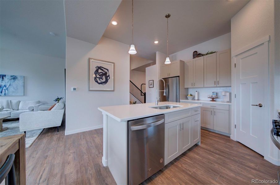 Looking from the kitchen back towards the entry and stairs.