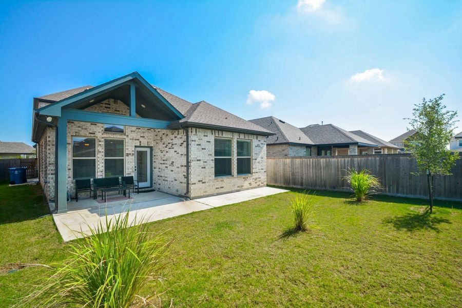 Step outside to a spacious, fully fenced backyard where the covered patio extends your living space into the outdoors. Whether hosting weekend gatherings, dining al fresco, or enjoying a peaceful evening under the Texas sky, this private backyard offers the perfect balance of comfort, versatility, and room to make it your own. With plenty of room to gather, play, garden, or unwind, this inviting outdoor retreat is designed to be enjoyed throughout every season.