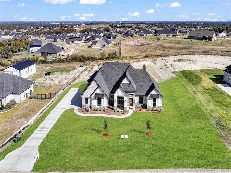Front exterior of a new home in , Weatherford, TX, highlighting curb appeal (Image 25).