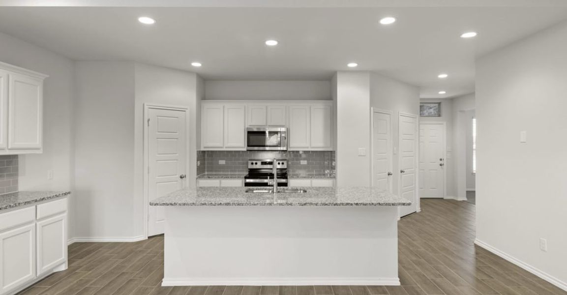 Representative exterior photo of a completed home built from the Raleigh by Impression Homes in Baker Farms, Cleburne, TX (Image 4).