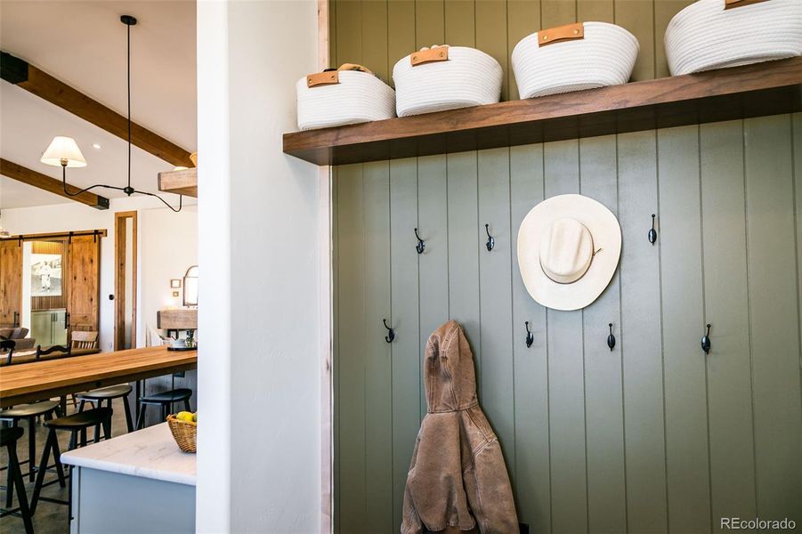 Landing pad/mudroom with custom built cabinets near the kitchen and back door.
