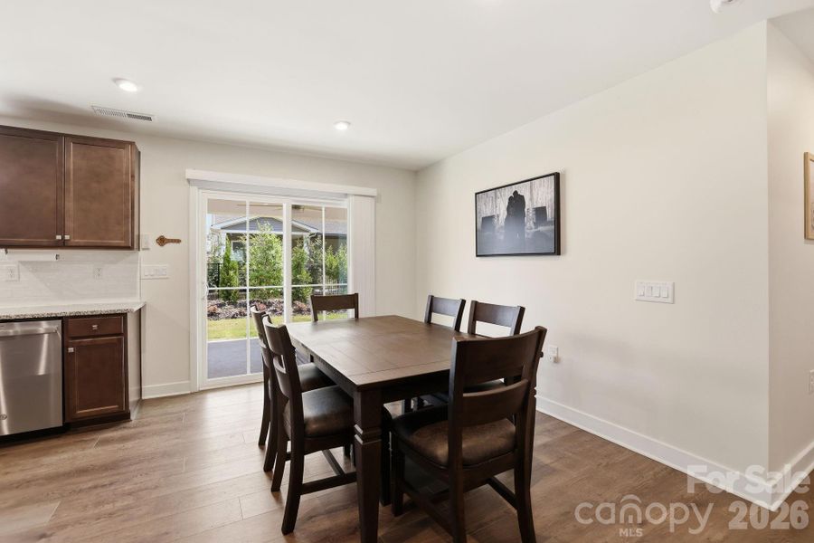 Dining area with sliding glass door to low maintenance rear entertaining space