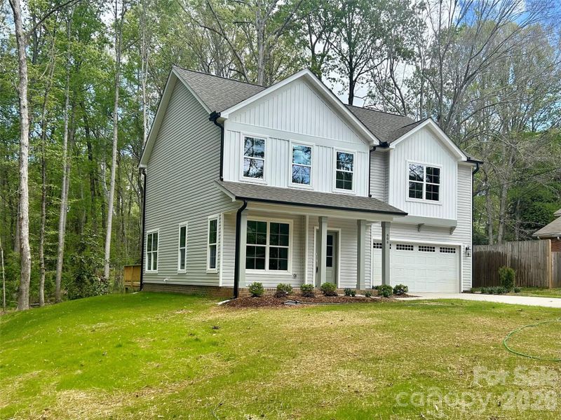 Front exterior of a new home in , Waxhaw, NC, highlighting curb appeal (Image 17).