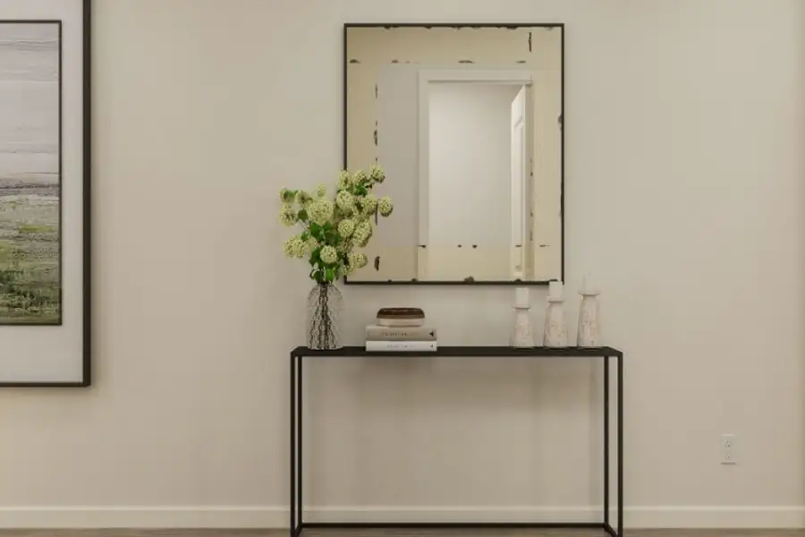 A vase with flowers on a table. A vase with flowers on a table.
