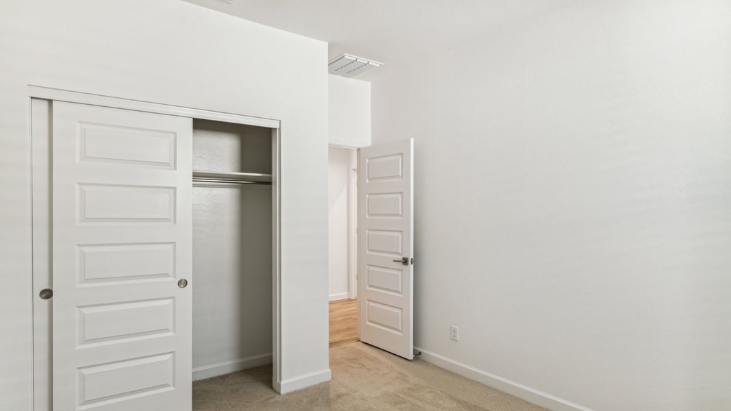 Representative unfurnished interior of a home built from the Cobalt by D.R. Horton in The Ridge at Stone Butte, Phoenix (Image 18).