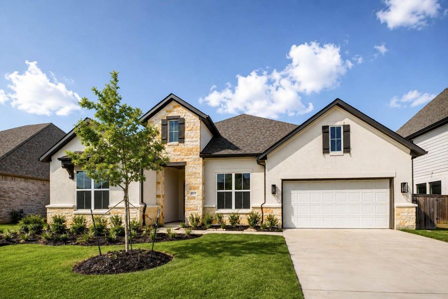 Modern single-story home featuring an oversized two-car garage with tandem space.