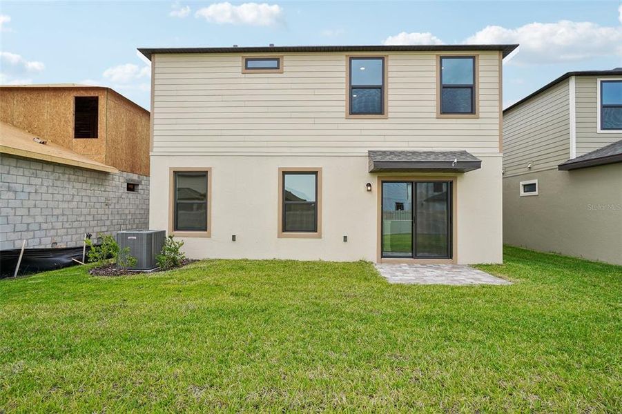 Exterior details and patio area of a home in Grasslands West, Lakeland (Image 23).