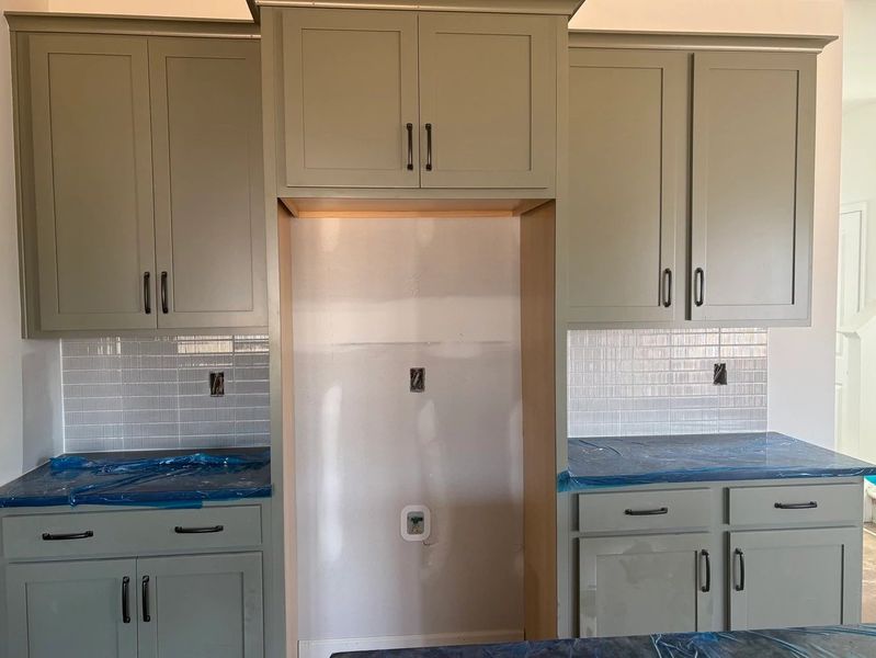 Kitchen featuring the AW Collection® Rosemary - Matte black, light wood, and garden-inspired style. Kitchen featuring the AW Collection® Rosemary - Matte black, light wood, and garden-inspired style.