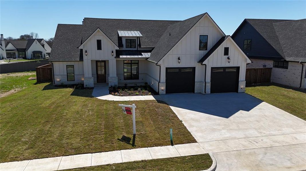 Front exterior of a new home in , Pottsboro, TX, highlighting curb appeal (Image 29).