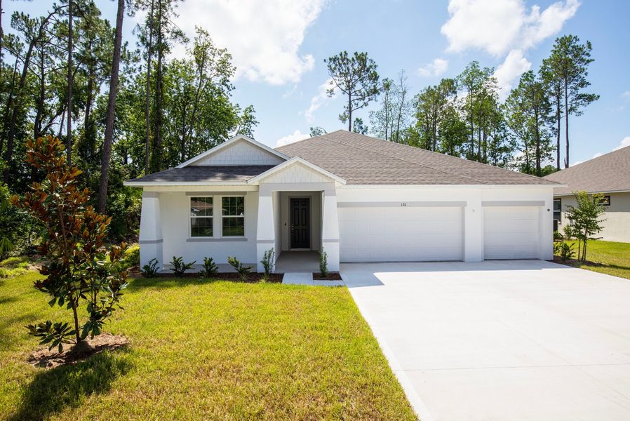 Front exterior of a new home in Sugarmill Woods, Homosassa, FL, highlighting curb appeal (Image 17).