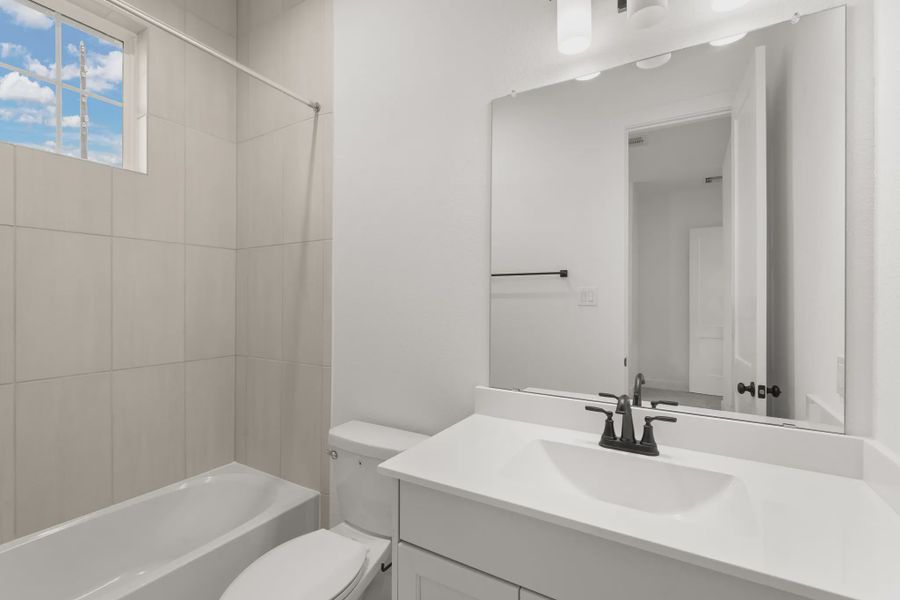 Representative furnished interior of a home built from the Palmer by Chesmar Homes in Riceland Alley Loads, Mont Belvieu (Image 11).