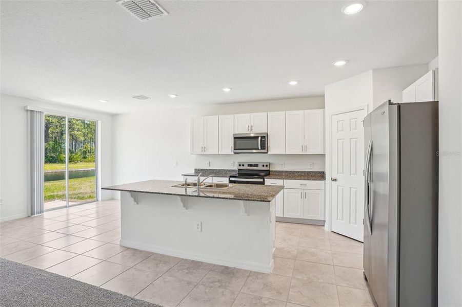 Furnished interior view inside a new home in Lake Deer Estates - Signature Series, Poinciana (Image 11). Furnished interior view inside a new home in Lake Deer Estates - Signature Series, Poinciana (Image 11).