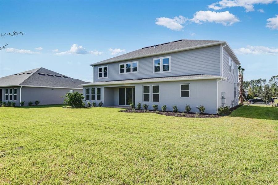 Exterior details and patio area of a home in Ardisia Park, New Smyrna Beach (Image 2).